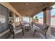 Covered patio area with an outdoor seating set at 3436 Camsore Point Ln, Las Vegas, NV 89129