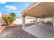 This covered patio has recessed lighting and a ceiling fan at 3436 Camsore Point Ln, Las Vegas, NV 89129