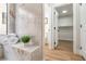 Shower with marble bench and view into the closet at 3436 Camsore Point Ln, Las Vegas, NV 89129