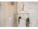 Close-up of modern shower with sleek fixtures, marble accents, and a built-in niche at 3436 Camsore Point Ln, Las Vegas, NV 89129