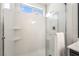 Modern bathroom shower features glass doors, a window, and built-in shelving at 3436 Camsore Point Ln, Las Vegas, NV 89129