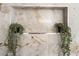 Shower niche with marble tile and decorative plants at 3436 Camsore Point Ln, Las Vegas, NV 89129