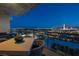 Balcony with a stunning night view of the city skyline, paired with outdoor furniture to enjoy the scenery at 353 E Bonneville Ave # 1302, Las Vegas, NV 89101