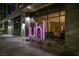 Striking nighttime view of the Juhl building entrance with modern architectural details and illuminated signage at 353 E Bonneville Ave # 1302, Las Vegas, NV 89101