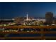 City view from the home's balcony with a beautiful railing to enjoy the night lights of the city at 353 E Bonneville Ave # 1302, Las Vegas, NV 89101
