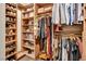 Walk-in closet featuring custom shelves and storage for shoes and clothing at 353 E Bonneville Ave # 1302, Las Vegas, NV 89101