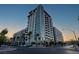 Modern high-rise condo building with balconies and palm trees at 353 E Bonneville Ave # 1302, Las Vegas, NV 89101