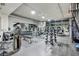 Spacious gym with a variety of modern exercise equipment and large windows at 353 E Bonneville Ave # 1302, Las Vegas, NV 89101