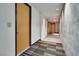 Bright hallway with modern lighting and colorful carpet design leading to residential units at 353 E Bonneville Ave # 1302, Las Vegas, NV 89101