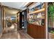 Hallway view of a custom bar and dining room in a modern condo at 353 E Bonneville Ave # 1302, Las Vegas, NV 89101