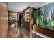 Hallway showcasing a custom bar, dining room with floor-to-ceiling windows, and contemporary design at 353 E Bonneville Ave # 1302, Las Vegas, NV 89101