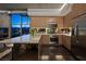 Modern kitchen with wood cabinets, stainless steel appliances, and a breakfast bar overlooking the city at 353 E Bonneville Ave # 1302, Las Vegas, NV 89101