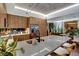 Kitchen with stainless steel appliances, eat in bar area, modern fixtures and lots of plants at 353 E Bonneville Ave # 1302, Las Vegas, NV 89101