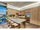 Modern kitchen with light wood cabinetry, stainless steel appliances, and a large island with counter seating at 353 E Bonneville Ave # 1302, Las Vegas, NV 89101