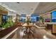 Modern living area showcasing a dining table, plant decor, and city views at 353 E Bonneville Ave # 1302, Las Vegas, NV 89101