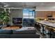 Open-concept living space featuring a modern sofa, city views through expansive windows, and sleek kitchen at 353 E Bonneville Ave # 1302, Las Vegas, NV 89101
