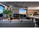 Contemporary living room featuring a modern gray sofa, floor-to-ceiling windows with city views, and a sleek, open layout at 353 E Bonneville Ave # 1302, Las Vegas, NV 89101