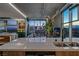 Modern living room with a concrete accent wall, city views, and sleek kitchen at 353 E Bonneville Ave # 1302, Las Vegas, NV 89101