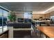 Open living room with floor to ceiling windows and modern kitchen with stainless steel appliances at 353 E Bonneville Ave # 1302, Las Vegas, NV 89101