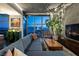 Cozy living room with a comfortable gray sofa and stunning city views at 353 E Bonneville Ave # 1302, Las Vegas, NV 89101