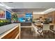 Bright living room featuring modern design, wood accents, and lush indoor plants at 353 E Bonneville Ave # 1302, Las Vegas, NV 89101