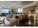 Open-concept living space with a modern kitchen, city views, and comfortable seating perfect for entertaining at 353 E Bonneville Ave # 1302, Las Vegas, NV 89101