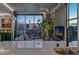 Modern living room featuring floor to ceiling windows with stunning city views and concrete accent walls at 353 E Bonneville Ave # 1302, Las Vegas, NV 89101