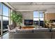 Bright and airy living room with floor-to-ceiling windows, comfortable seating, and cityscape views at 353 E Bonneville Ave # 1302, Las Vegas, NV 89101