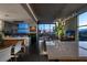 Open living room and kitchen with luxury design and city views from floor to ceiling windows at 353 E Bonneville Ave # 1302, Las Vegas, NV 89101