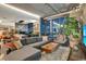 Open floor plan living area with modern decor, large windows with a city view, plants and lots of light at 353 E Bonneville Ave # 1302, Las Vegas, NV 89101