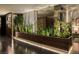 Sleek living space features modern design with greenery, contemporary lighting, and stylish decor at 353 E Bonneville Ave # 1302, Las Vegas, NV 89101