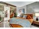 Comfortable main bedroom featuring a king bed, mirrored dressing area, and an organized closet at 353 E Bonneville Ave # 1302, Las Vegas, NV 89101