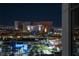 Stunning night view from condo showcasing a commercial center and brightly lit city skyline at 353 E Bonneville Ave # 1302, Las Vegas, NV 89101