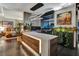 Bright home office featuring modern desk with a bedroom in the background and contemporary artwork at 353 E Bonneville Ave # 1302, Las Vegas, NV 89101