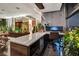 Bright home office boasts modern desk with a bedroom beyond and lush greenery at 353 E Bonneville Ave # 1302, Las Vegas, NV 89101