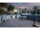 Outdoor kitchen area with modern appliances, a dining table, and seating at 353 E Bonneville Ave # 1302, Las Vegas, NV 89101