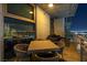 Outdoor patio with a lounge seating area and a stunning view of the city skyline at night at 353 E Bonneville Ave # 1302, Las Vegas, NV 89101
