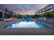 Resort-style pool with palm trees, sun loungers, and clear blue water at 353 E Bonneville Ave # 1302, Las Vegas, NV 89101