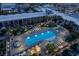 An aerial view of a luxurious pool area featuring an elongated pool, sunbeds and landscaping at 353 E Bonneville Ave # 1302, Las Vegas, NV 89101
