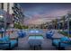 Luxury apartment complex featuring a pool, spa, palm trees and lounge area at 353 E Bonneville Ave # 1302, Las Vegas, NV 89101