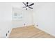 Bright bedroom featuring a ceiling fan, light wood floors, and a bright atmosphere at 3654 Villa Knolls South Dr, Las Vegas, NV 89120
