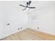 Bedroom features a ceiling fan, light wood floors, and a window providing natural light at 3654 Villa Knolls South Dr, Las Vegas, NV 89120