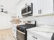 Modern kitchen with stainless steel appliances and marble countertops at 3654 Villa Knolls South Dr, Las Vegas, NV 89120