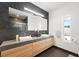 Elegant bathroom featuring a double vanity, sleek vessel sinks, and a frameless glass shower enclosure at 3740 Caesars Cir, Las Vegas, NV 89120
