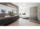 Sleek bathroom featuring double sinks, a modern bathtub, a walk-in shower, and neutral-toned tiles and decor at 3740 Caesars Cir, Las Vegas, NV 89120