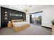Modern bedroom with access to a private balcony offering natural light and views of the surrounding area at 3740 Caesars Cir, Las Vegas, NV 89120