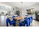 Stylish dining room featuring unique furniture, high ceilings, and a modern chandelier for elegant gatherings at 3740 Caesars Cir, Las Vegas, NV 89120