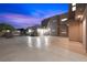 Long driveway leading to a modern home with ample parking and clean lines, showcasing contemporary design at 3740 Caesars Cir, Las Vegas, NV 89120