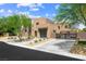 Contemporary two-story home with a glass garage door, desert landscaping, and a private gate at 3740 Caesars Cir, Las Vegas, NV 89120