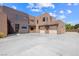 Beautiful front exterior showcasing the home's modern design, spacious driveway, and multi-car garage at 3740 Caesars Cir, Las Vegas, NV 89120